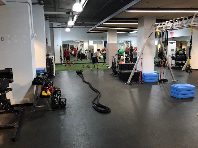 Open rehabilitation gym space with exercise equipment and mobility training tools at Park Avenue.
