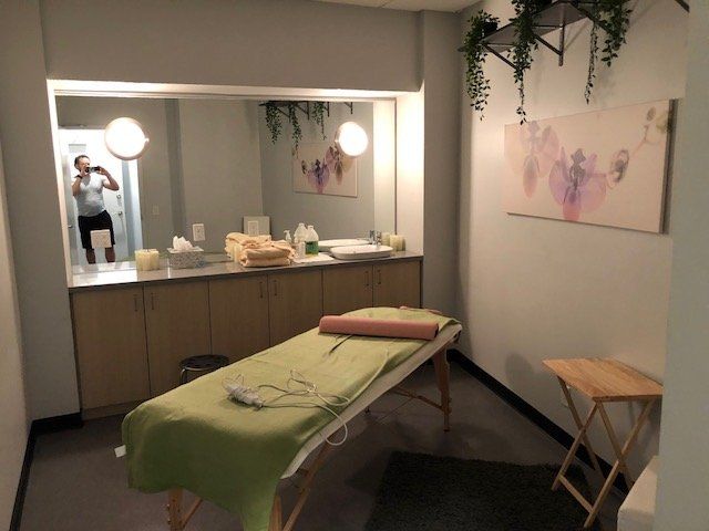 Private treatment room with massage table and calming decor at the Park Avenue clinic.
