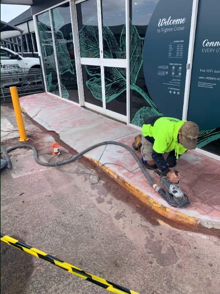 A Covered Walkway with Stairs Leading up To a Building — Illawarra Resurfacing Pty Ltd in Balgownie, NSW
