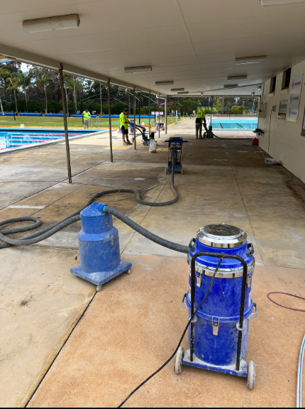 A Concrete Driveway Is Being Built in The Backyard of A House — Illawarra Resurfacing Pty Ltd in Balgownie, NSW