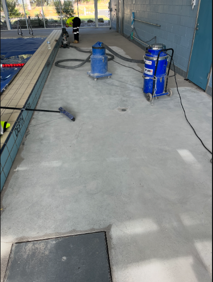 A Worker Preparing the Surface of a Driveway — Illawarra Resurfacing Pty Ltd in Balgownie, NSW