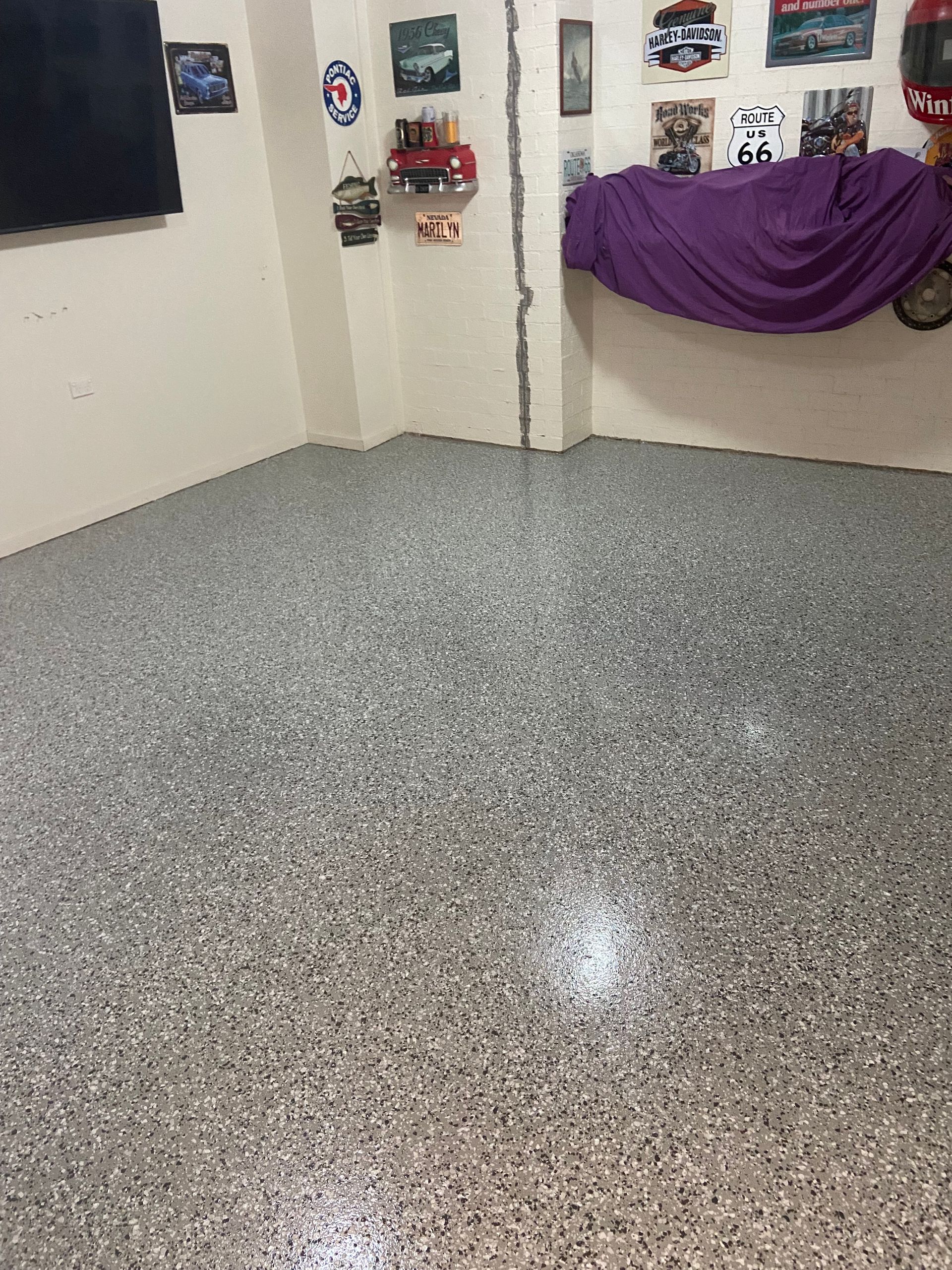 A Garage with A Sliding Garage Door and A Window — Illawarra Resurfacing Pty Ltd in Austinmer, NSW