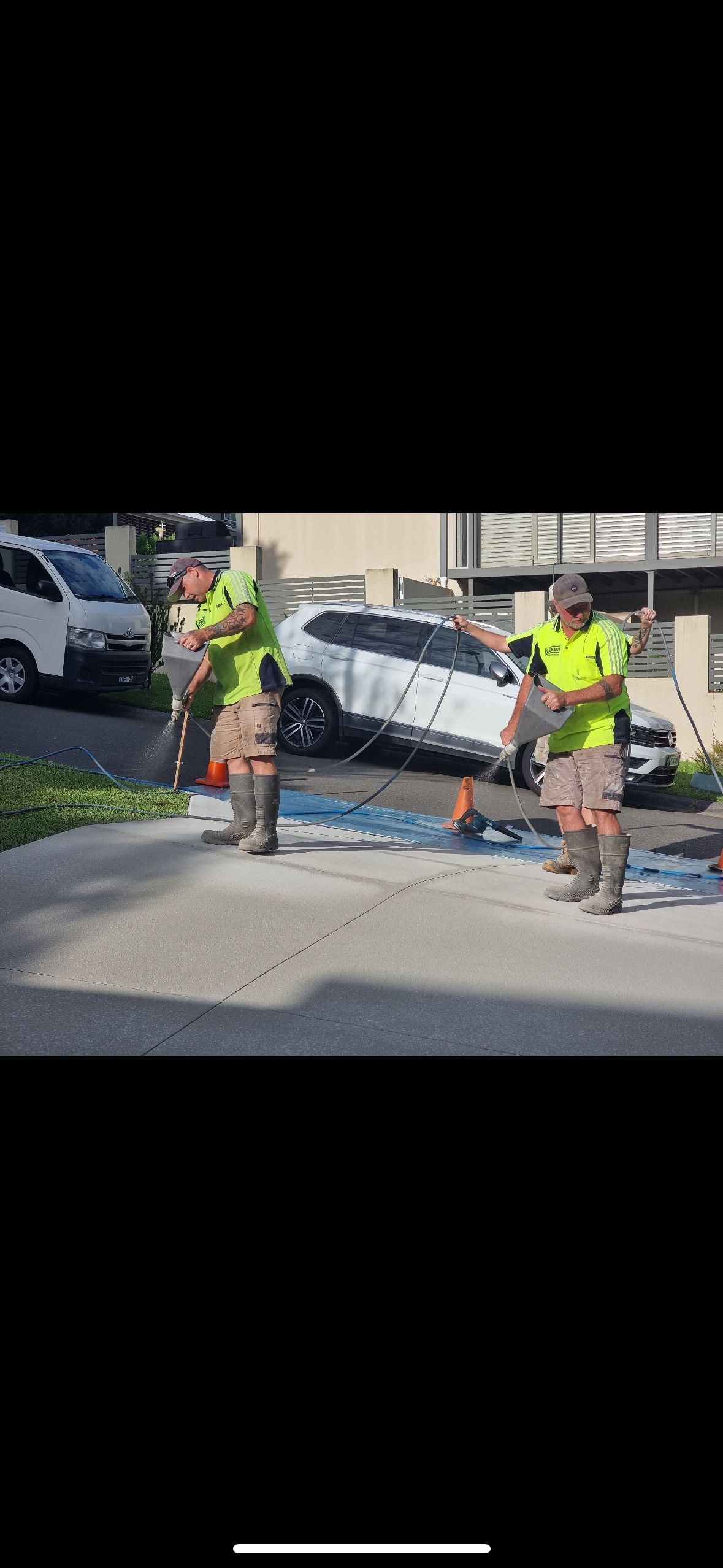 A White SUV Is Parked in A Driveway Next to A Garage — Illawarra Resurfacing Pty Ltd in Balgownie, NSW