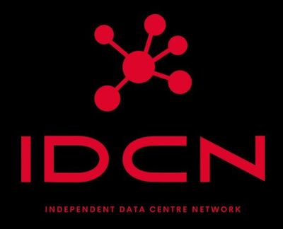 Data center hallway with server racks and blue-lit environment.