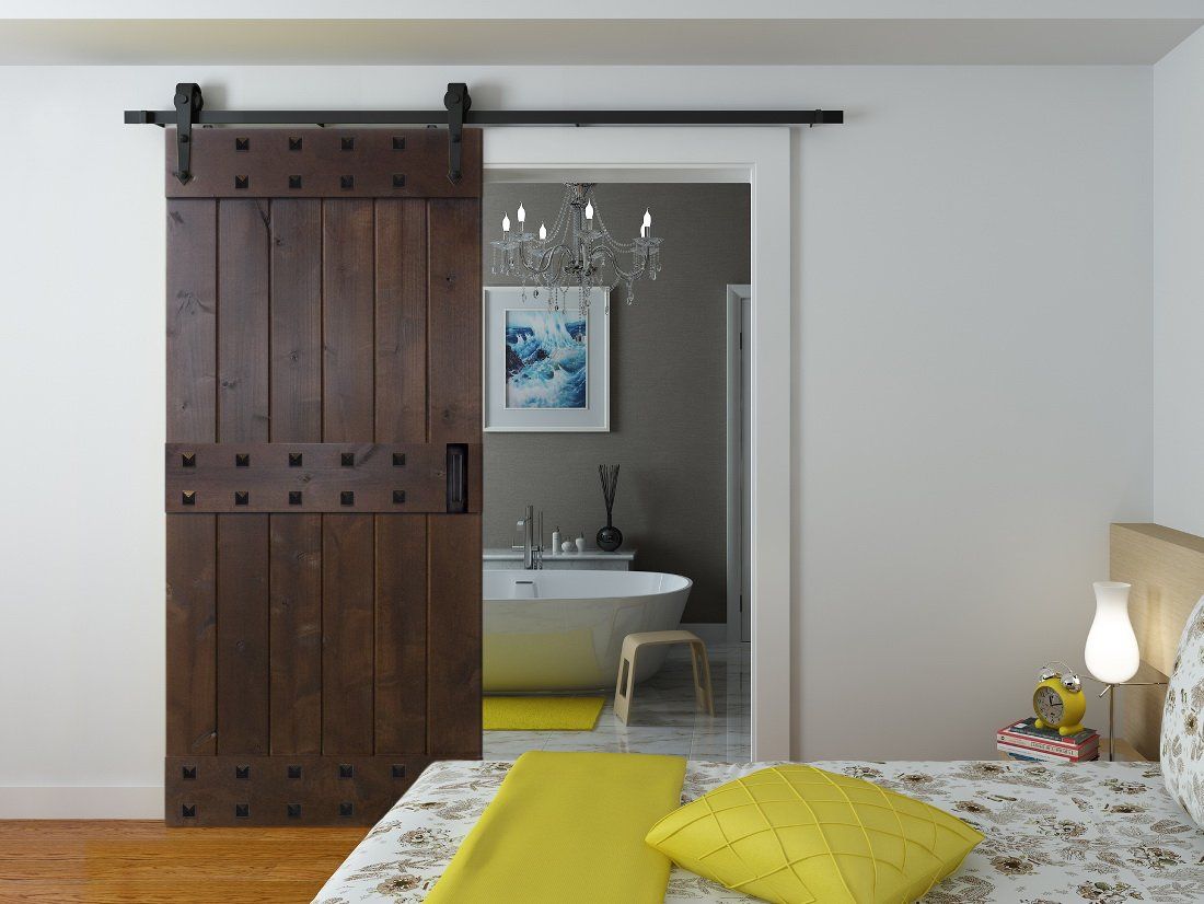 Studded Interior Barn Door in Bedroom