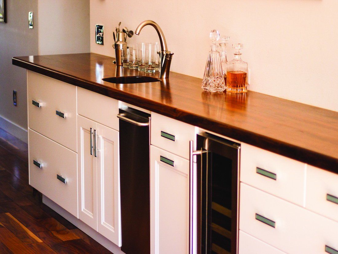 bathroom with black and white cabinets