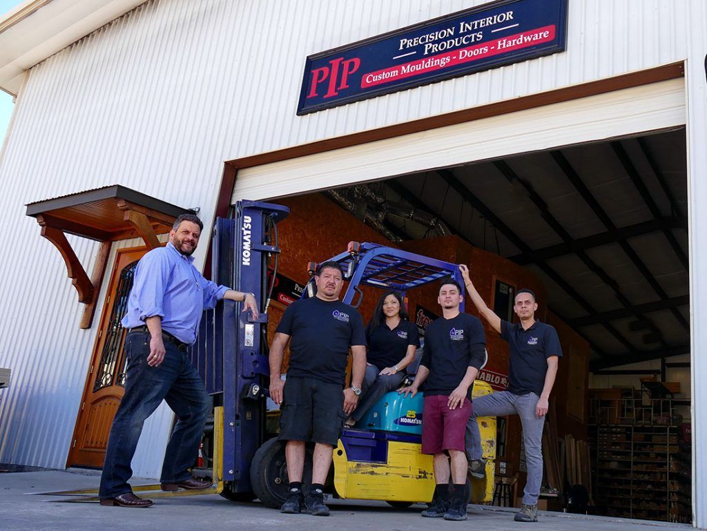 Precision Interior Products' Team in Front of Store