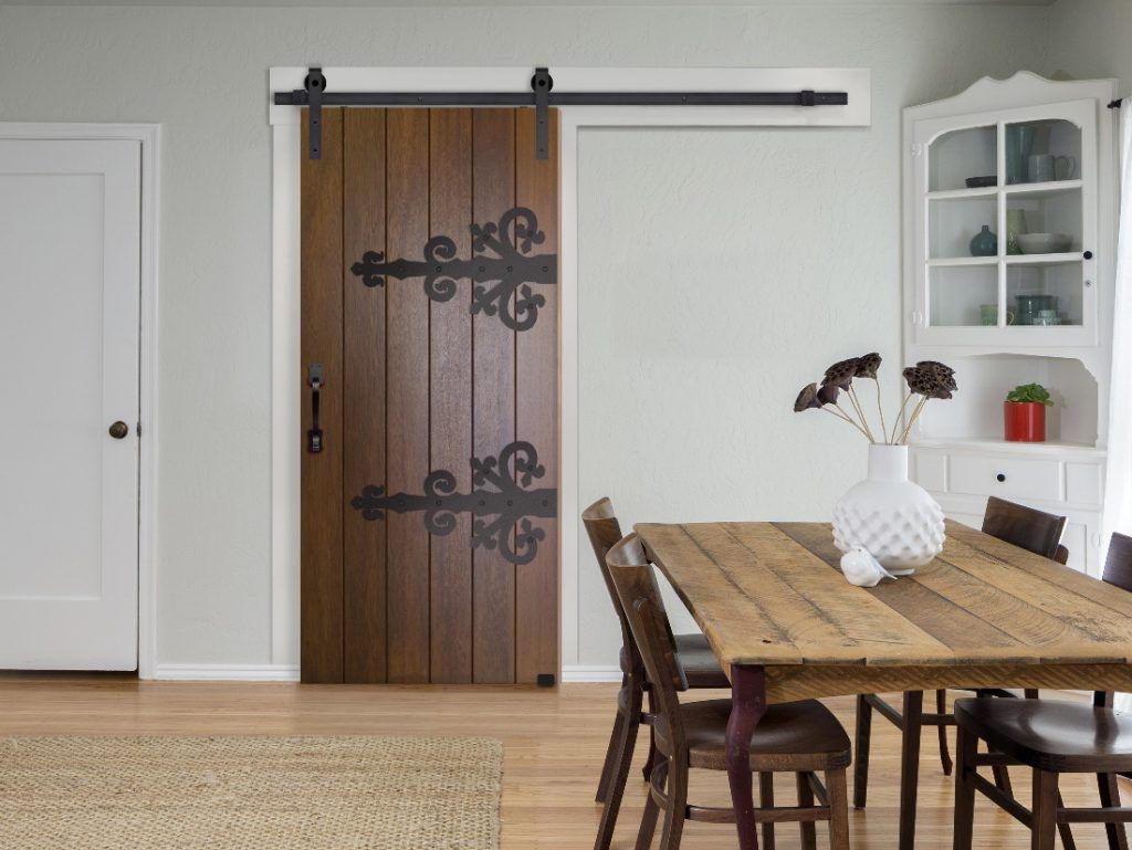 sliding door in dining room with barn door hardware