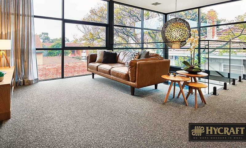 A Living Room With a Couch, Tables, and a Large Window — Floor Zone Gympie In Gympie, QLD