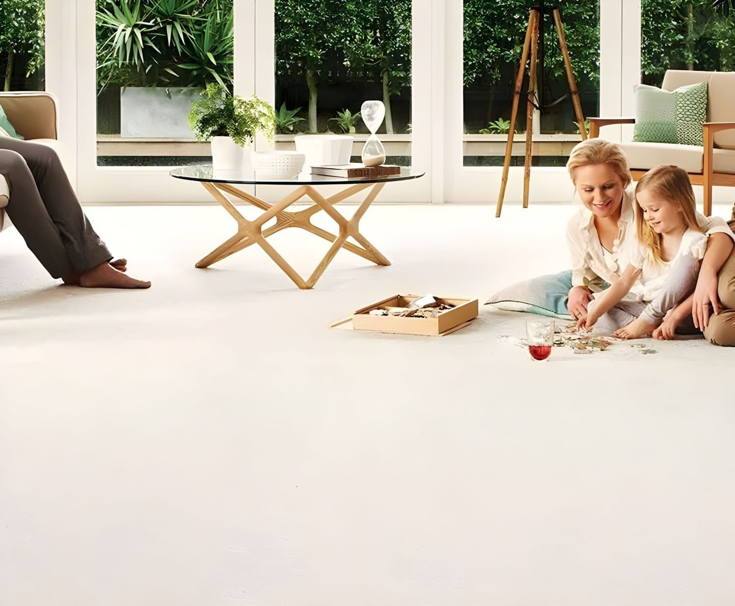 A Woman and Child Are Sitting on the Floor in a Living Room — Floor Zone Gympie In Gympie, QLD