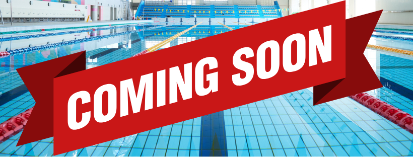 A swimming pool with a red banner that reads 