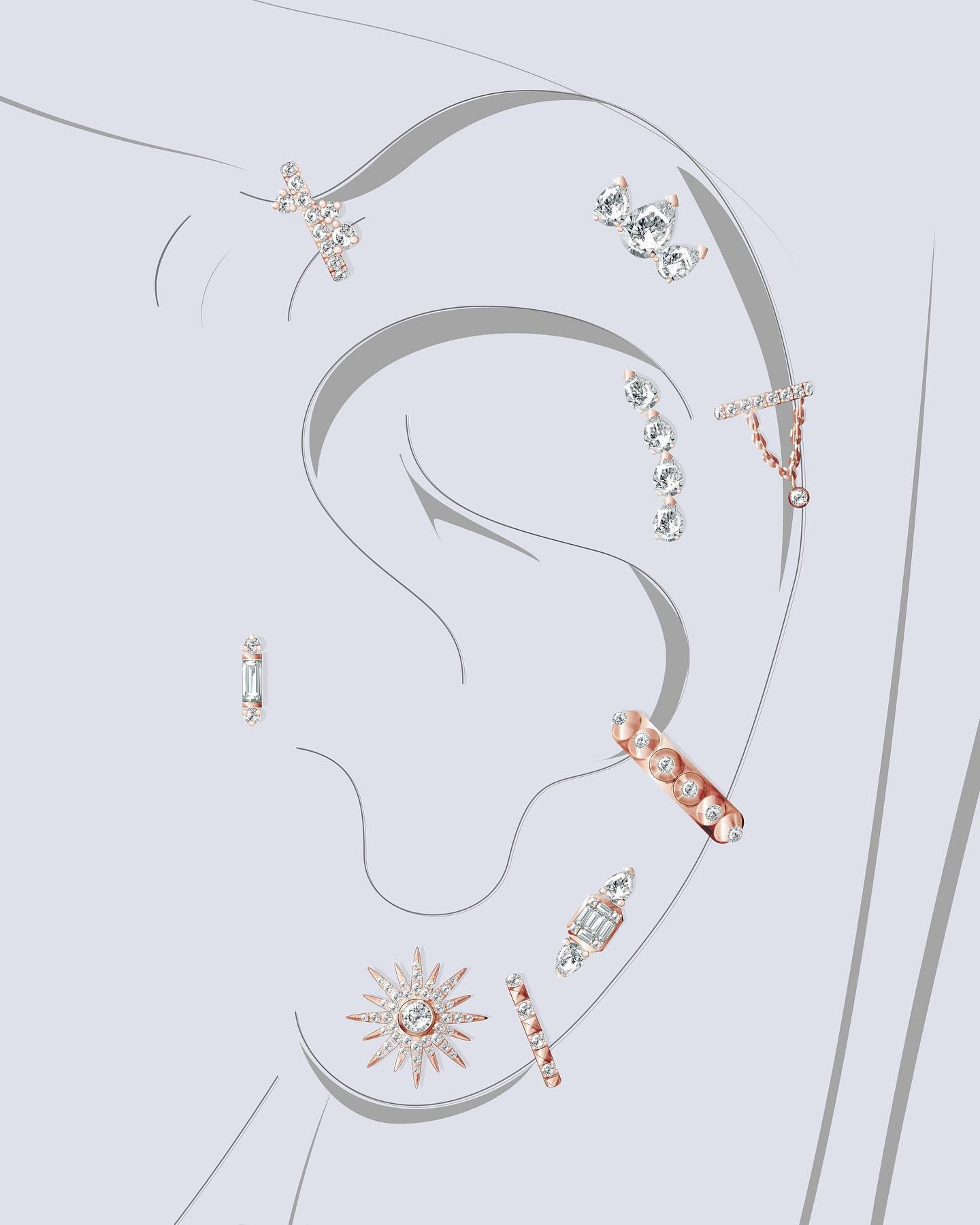 Oreille avec plusieurs boucles d'oreilles délicates, comportant des diamants et des formes variées.