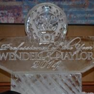 Clear crystal award engraved “Wendell Naylor” with “2014” on a glass base.