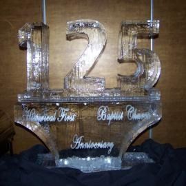 Clear crystal ice sculptured “125” anniversary display with engraved text on a stand