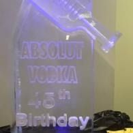 Glowing Absolut Vodka bottle-shaped birthday sign with “45th Birthday” text