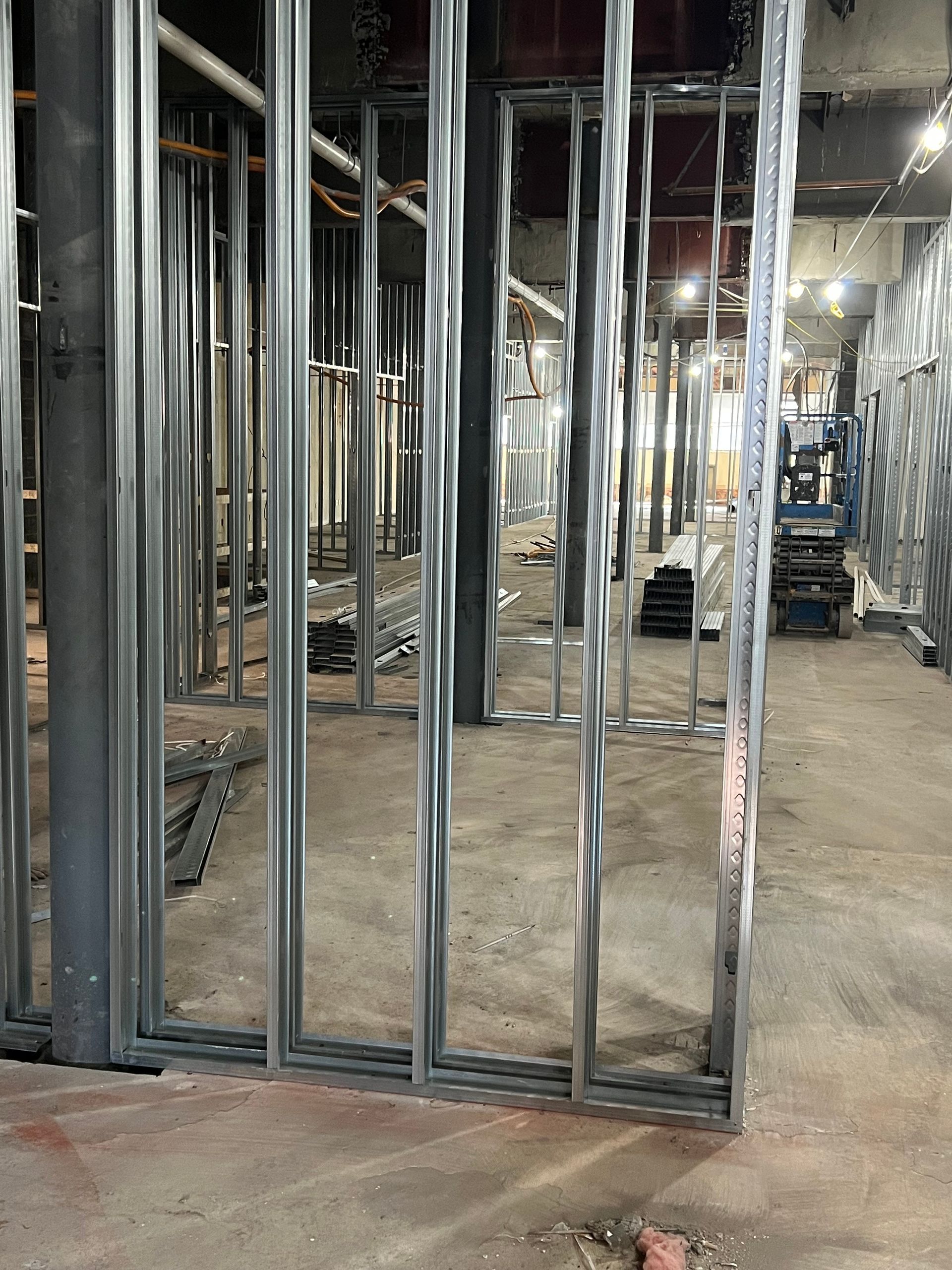 Metal framing for interior walls in a construction site.