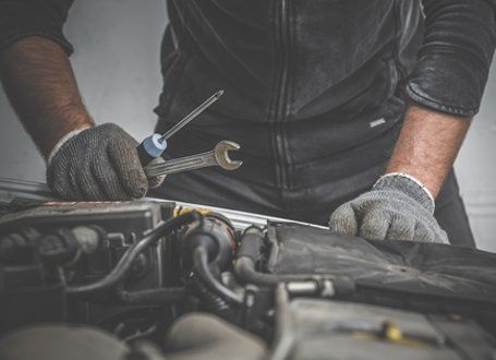 Auto Repair — A Mechanic Holding Car Repair Tools in Antioch, CA