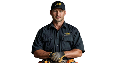 Man in work uniform and cap, arms crossed, looking at the viewer.