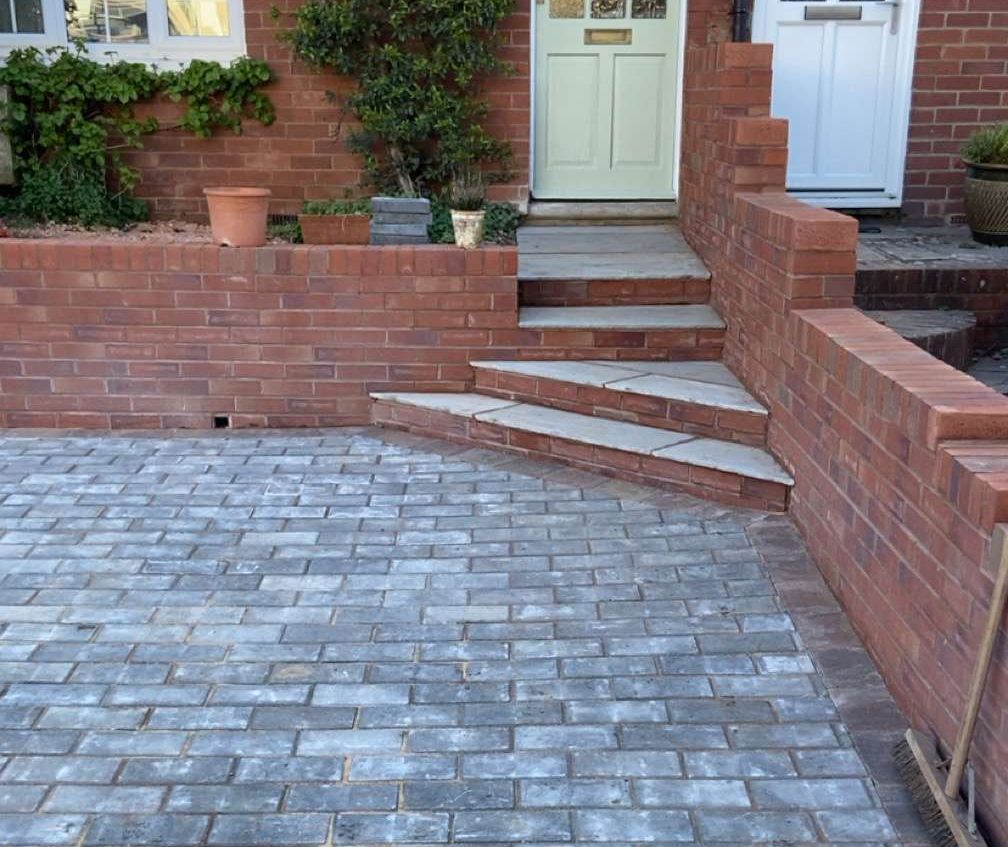 A new cavity block wall built on site with ladder and tools