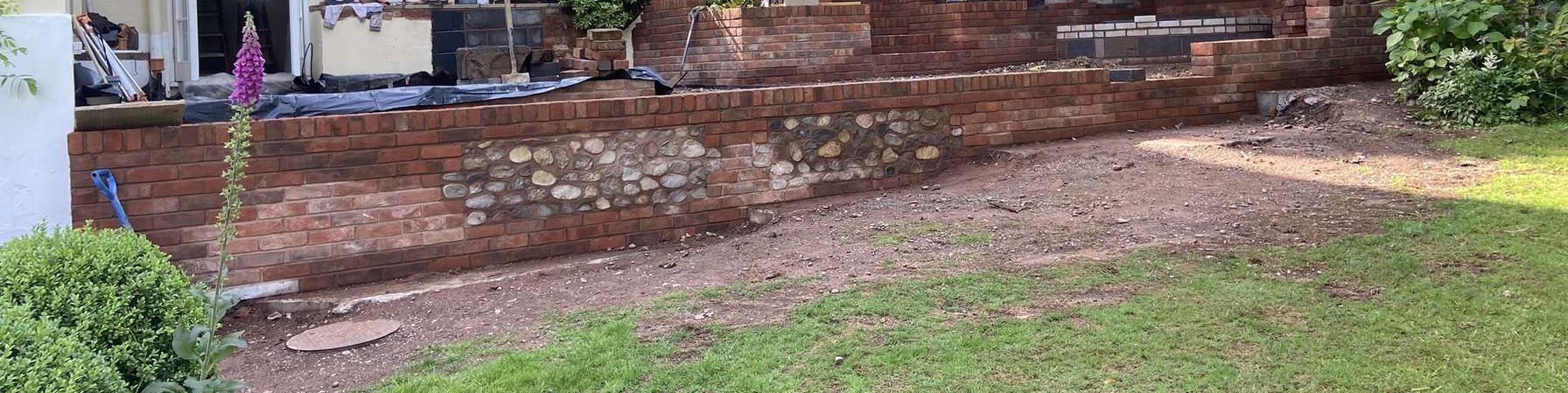 reviews and feedback from customers with a brick wall in the garden