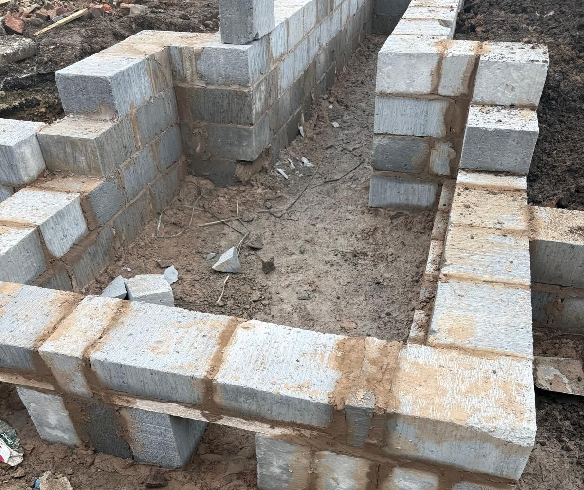 A stone block masonry wall project during the build