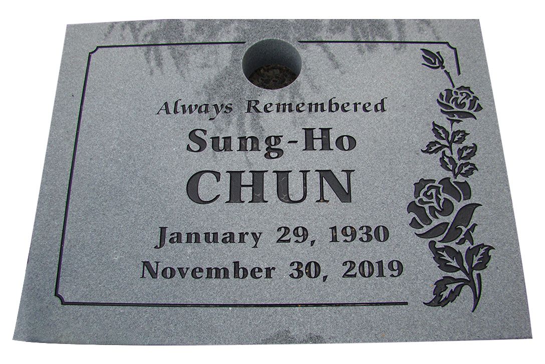 a gravestone for sung-ho chun , who died on november 30 , 2019