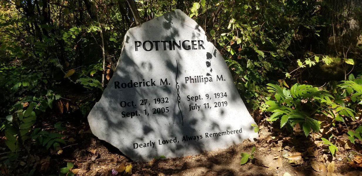 a large rock with the name pottinger on it