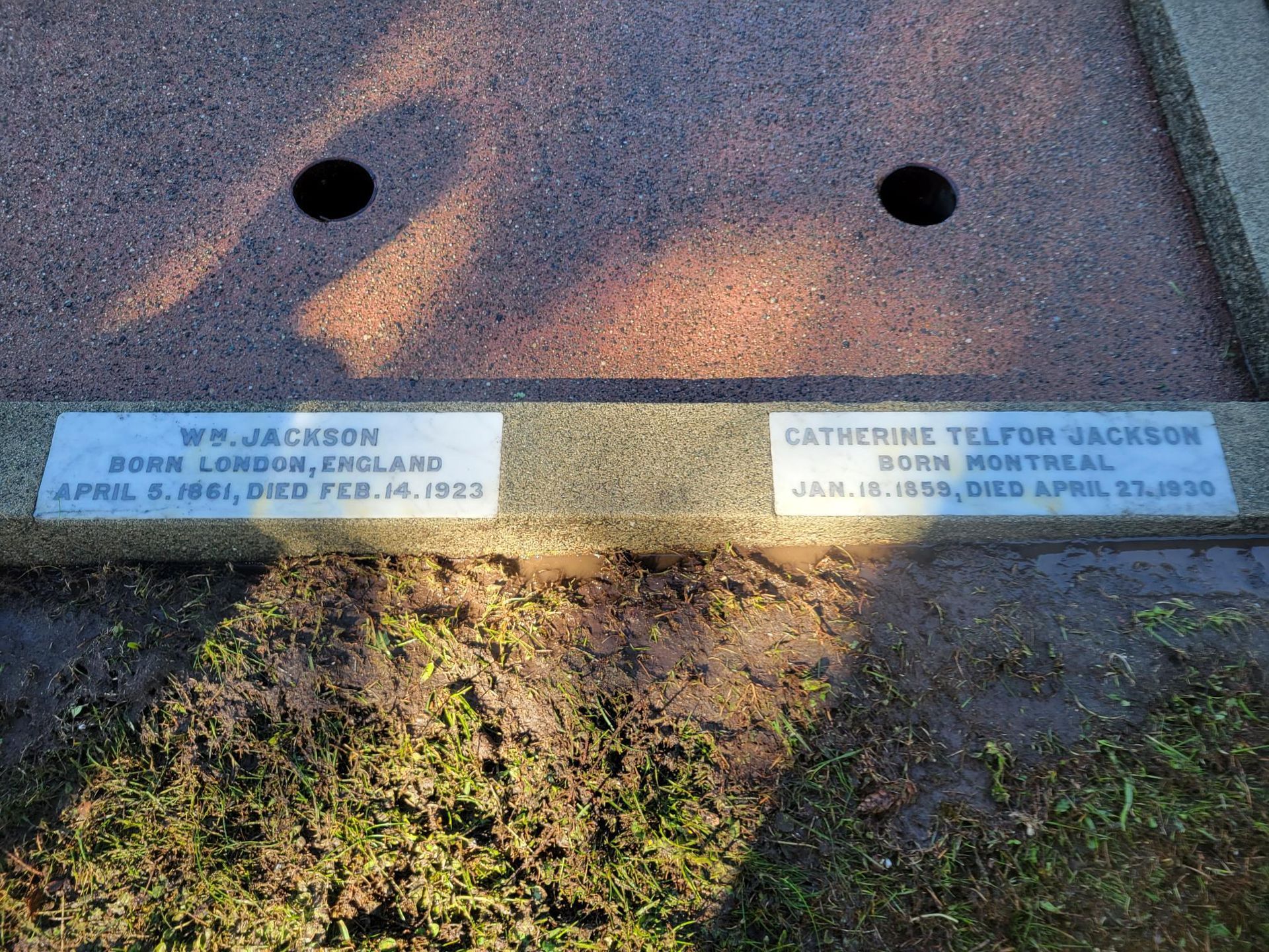 a gravestone for wm jackson and catherine telfor jackson