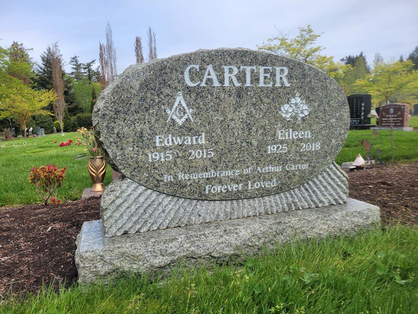 a gravestone for edward carter in a cemetery .