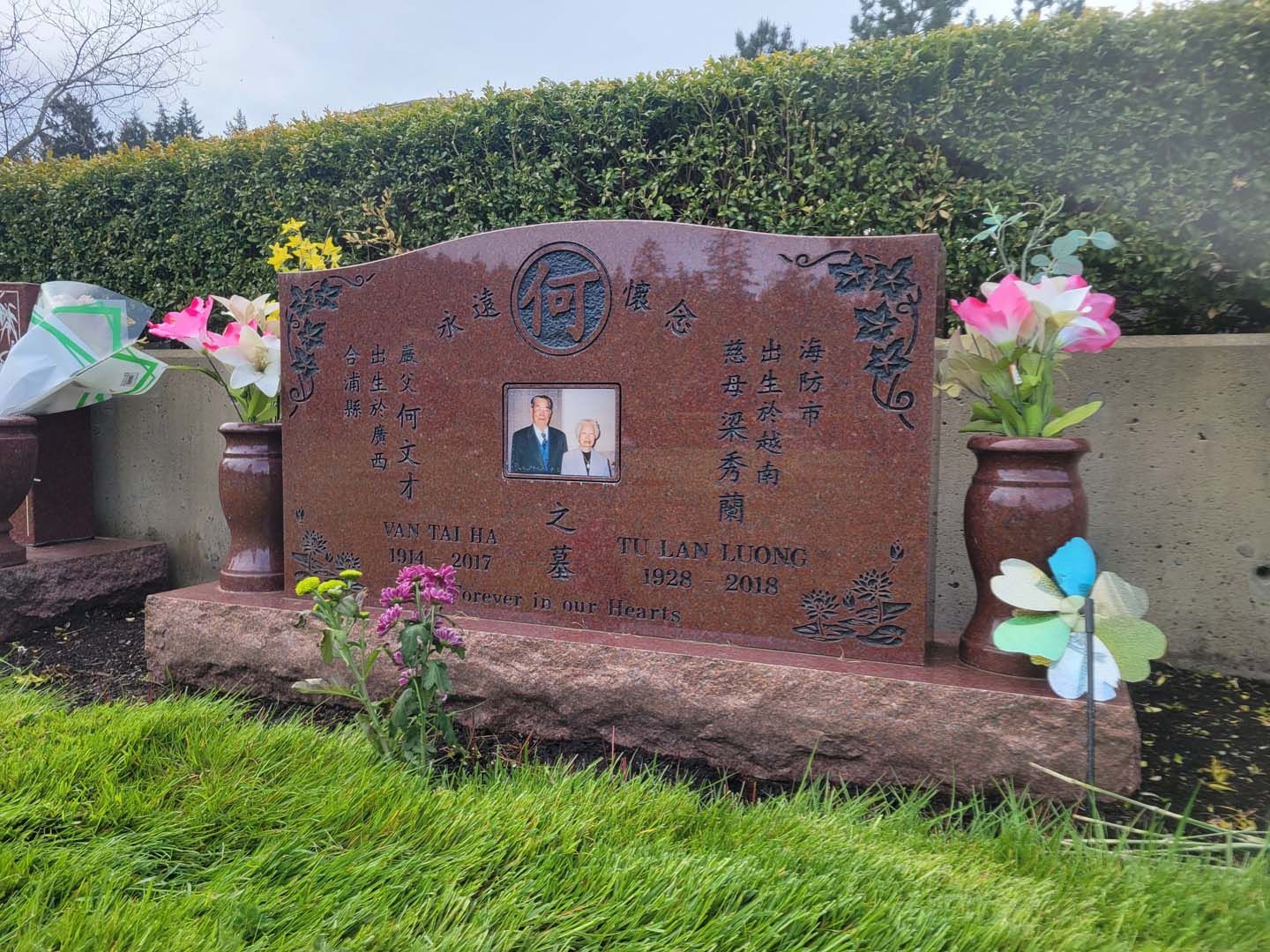 a gravestone with a picture of a man on it