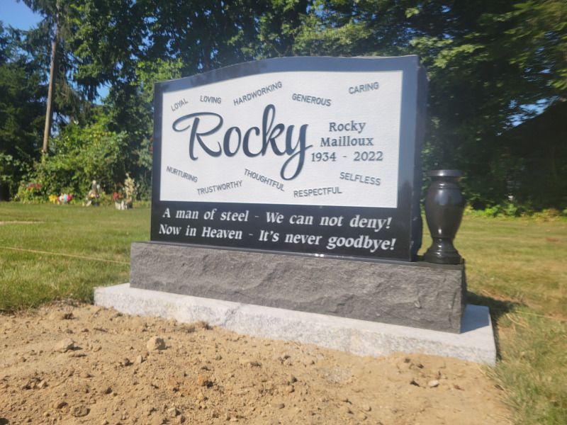 a gravestone with the name rocky on it