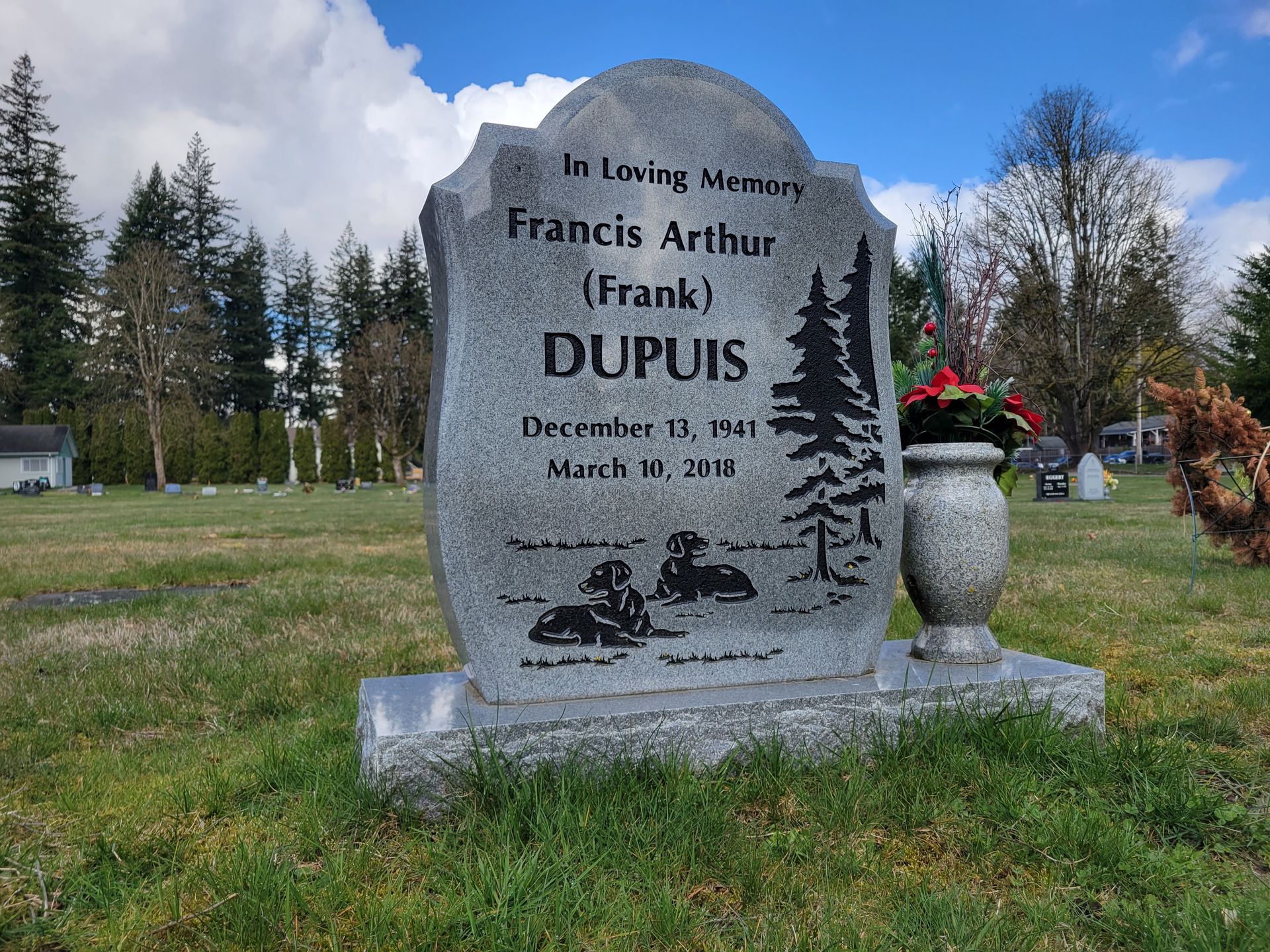 a gravestone in a cemetery for francis arthur dupuis