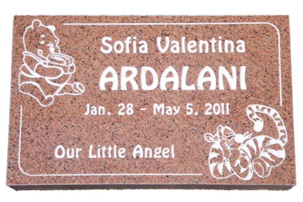 A gravestone for sofia valentina ardalani with winnie the pooh and tigger on it