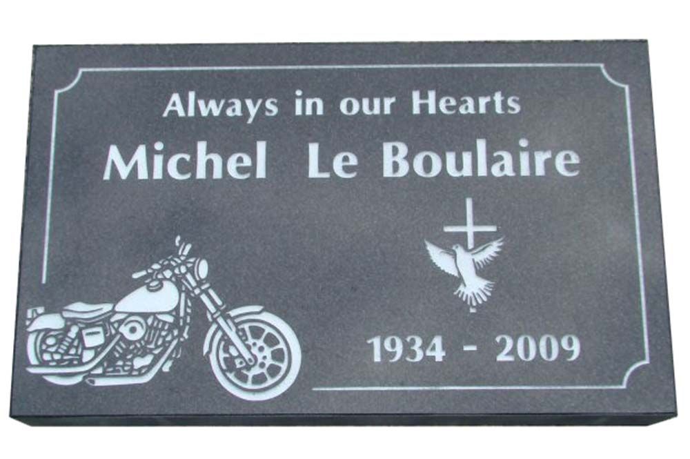A memorial for michel le boulaire with a motorcycle on it