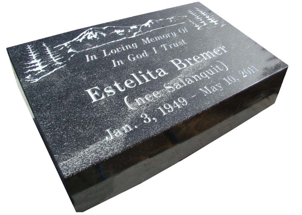 A black gravestone with the name estelita bremer on it