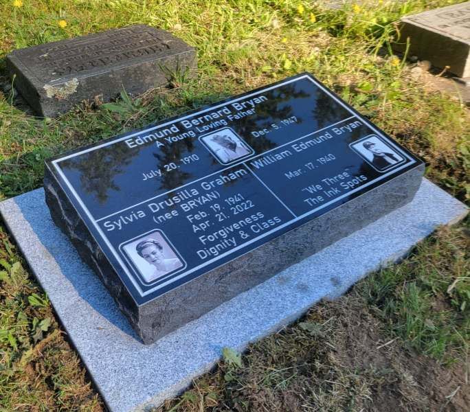 A gravestone for edmund bernard bryan and sylvia drusilla graham