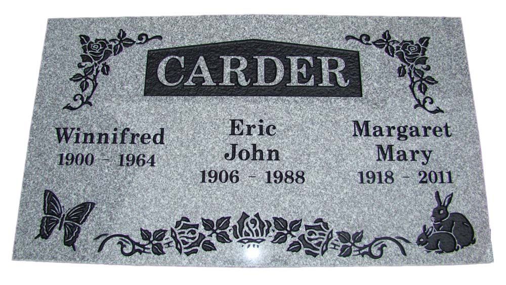 A gravestone for eric john and margaret mary with butterflies and rabbits on it.