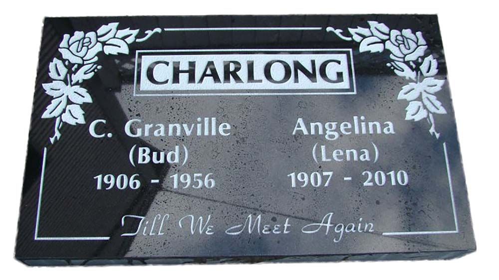 A black gravestone with the name charlong on it