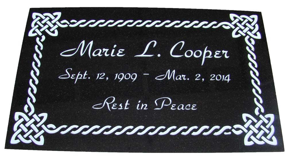A black plaque with the name marie l. cooper on it
