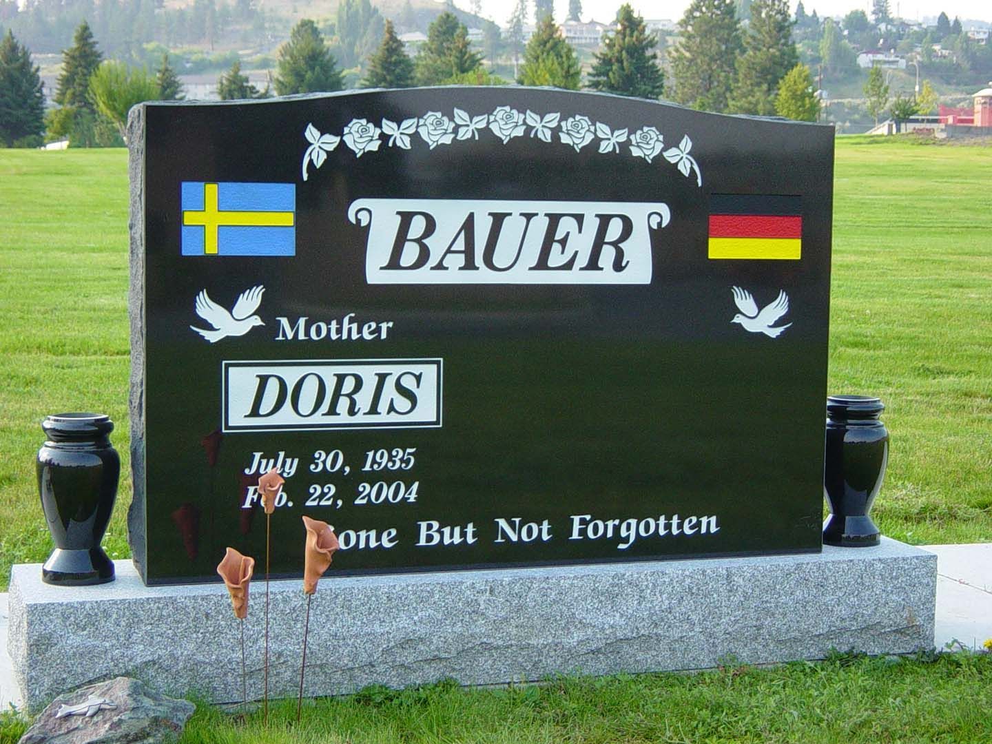a black gravestone with the name doris on it