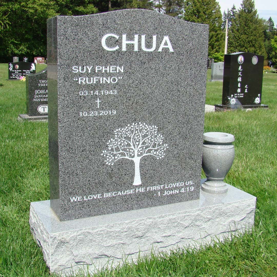 a gravestone in a cemetery with the name chua on it
