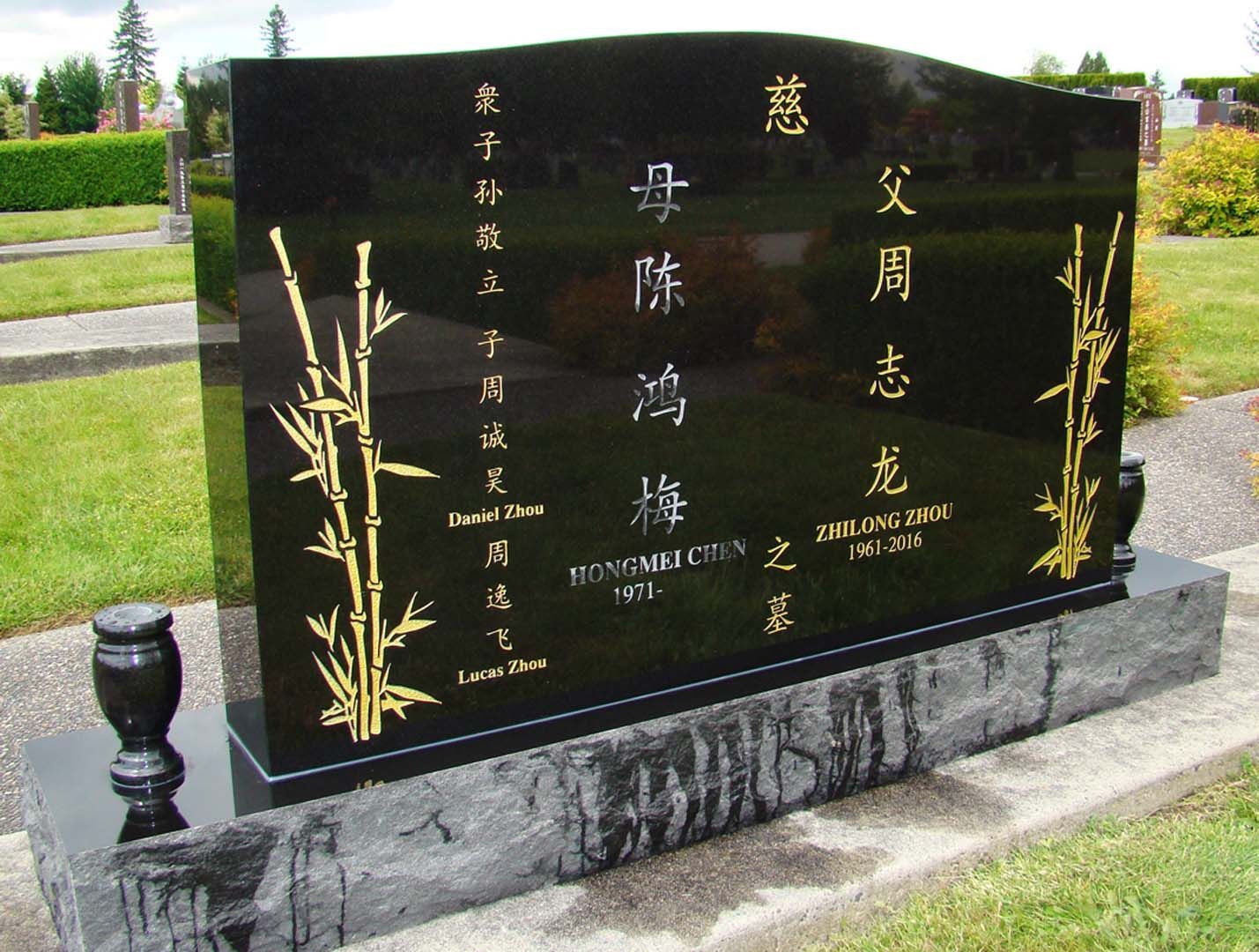 a large black monument with chinese writing on it