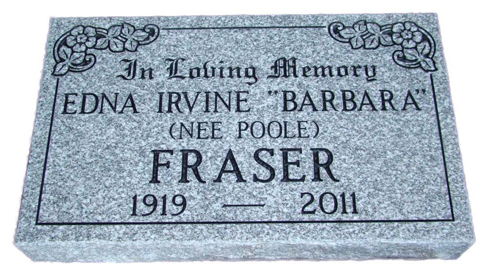 A gravestone for edna irvine barbara is sitting on a white background.