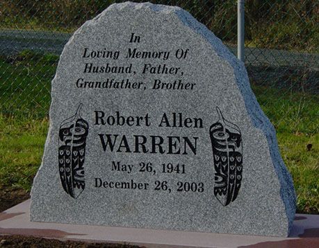 A gravestone for robert allen warren who died on december 26 2003
