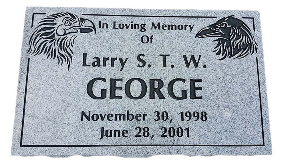 A gravestone for larry s. t. w. george who died on november 30 1998