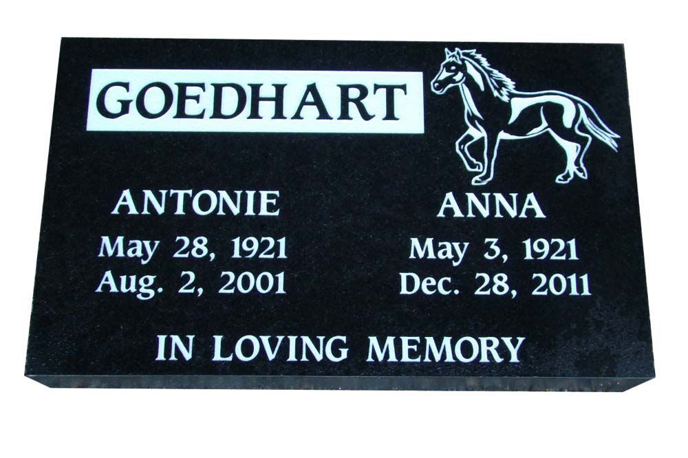 A black grave marker for antonie and anna