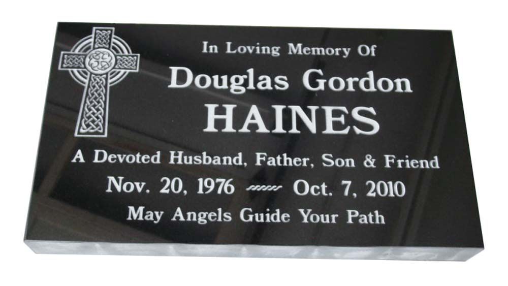 A gravestone for douglas gordon haines a devoted husband father son and friend