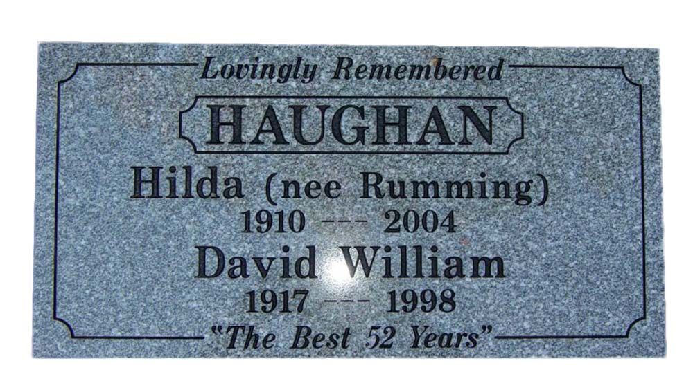 A gravestone for a man and a woman named haughan