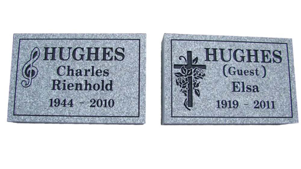 Two grave markers for charles rienhold and elsa hughes