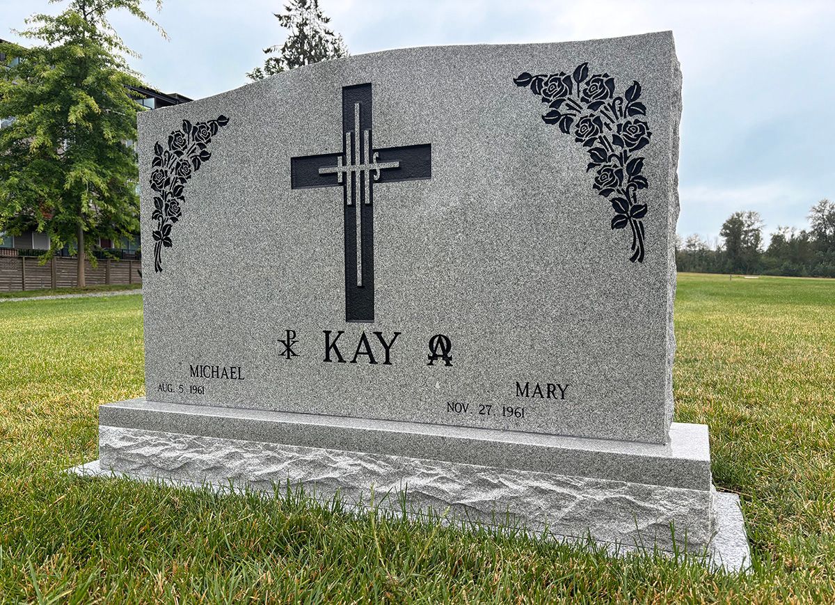 Photo of a memorial marker i a cemetery. The marker is 30